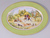 Decorative plate with hunting scenerie, green brim and golden accessories